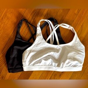 Pair Lululemon Sports Bras Size 12 fits a size ten. White and black.